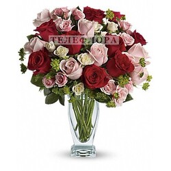 Round bouquet of red, pink and white roses
